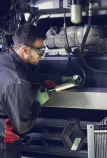 Man repairing trucks