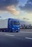 E-Tech T on the road with city in the background